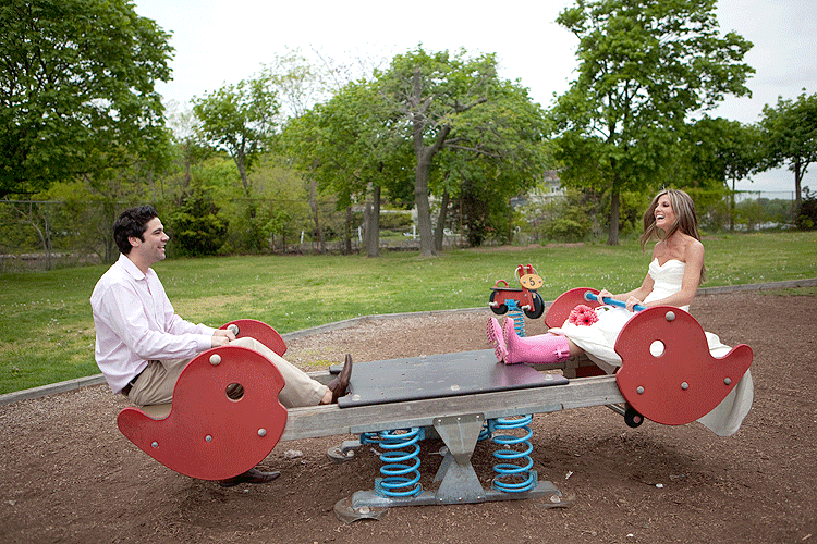 Rock the frock photography session in CT - bride and groom riding the seesaw