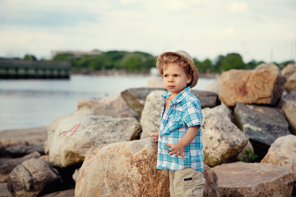 Greenwich CT children photographer - boy posing by the rocks
