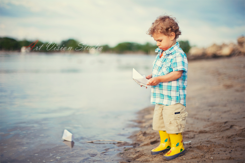 A toddler with origami boat- Stamford, CT toddler photographer