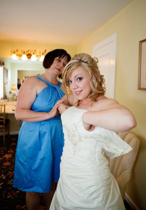 Bride putting on the wedding dress- Stamford photojournalistic wedding photography