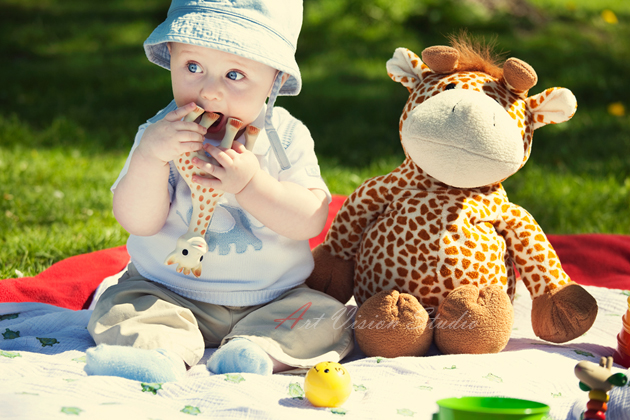 Baby boy with toys- outdoors children photography