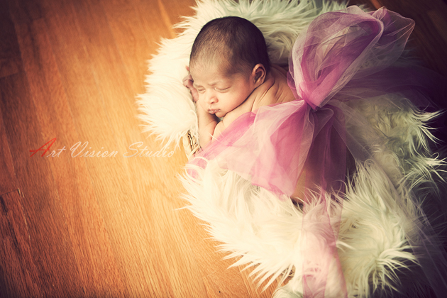 Newborn baby posing in a gift basket- infant photography in Stamford,CT