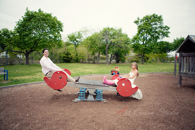 Creative wedding photographer NY - bride and groom riding the seesaw