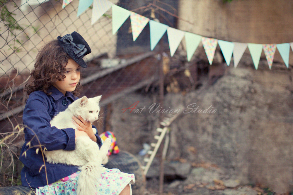 Greenwich CT child photographer - A girl posing with a cat