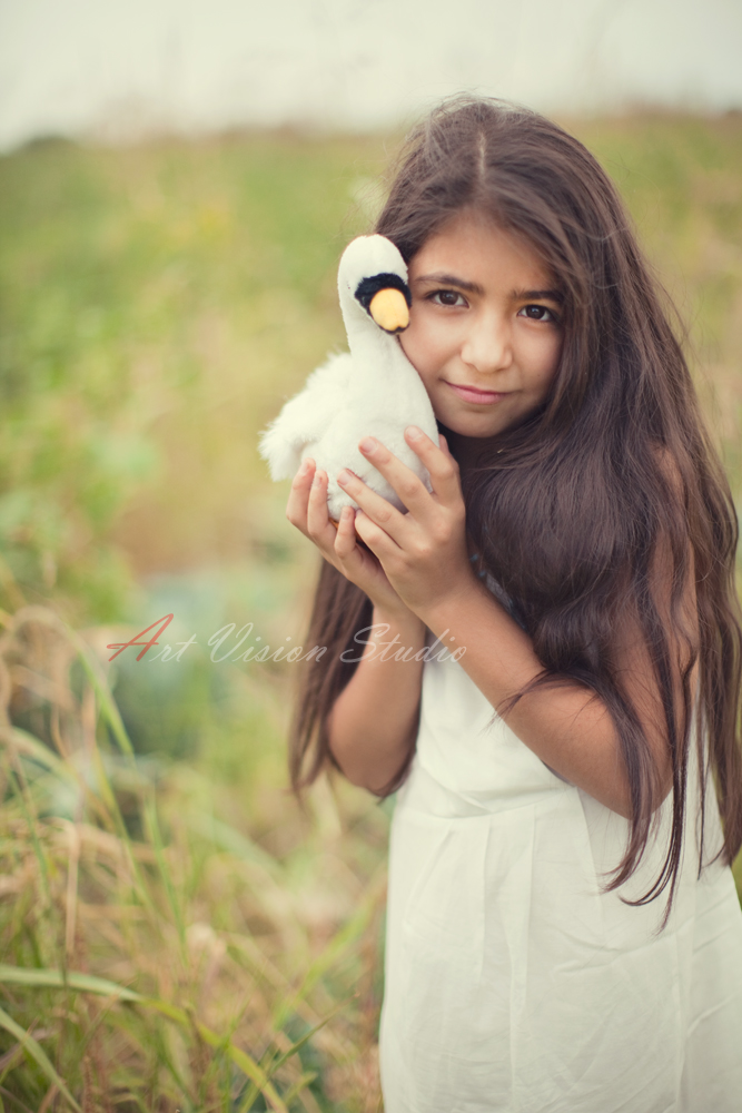 Family photographer in Darien, CT -  A girl in a white dress