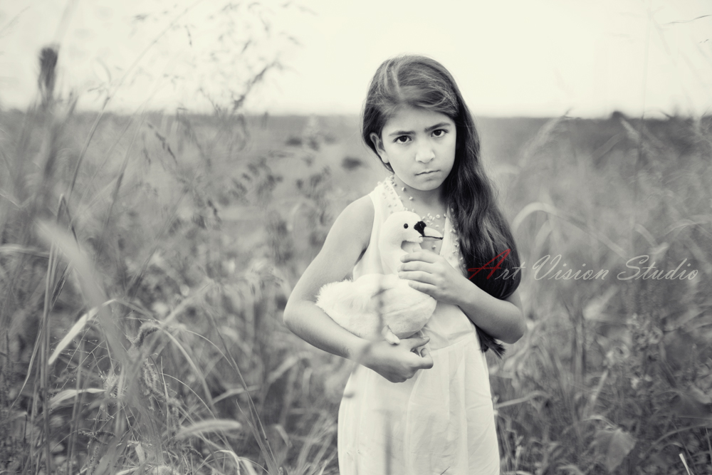  Kids themed photography in CT - A girl with a swan in the field