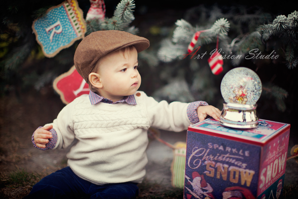 Greenwich, CT baby photographer - Baby boy posing with a snow globe