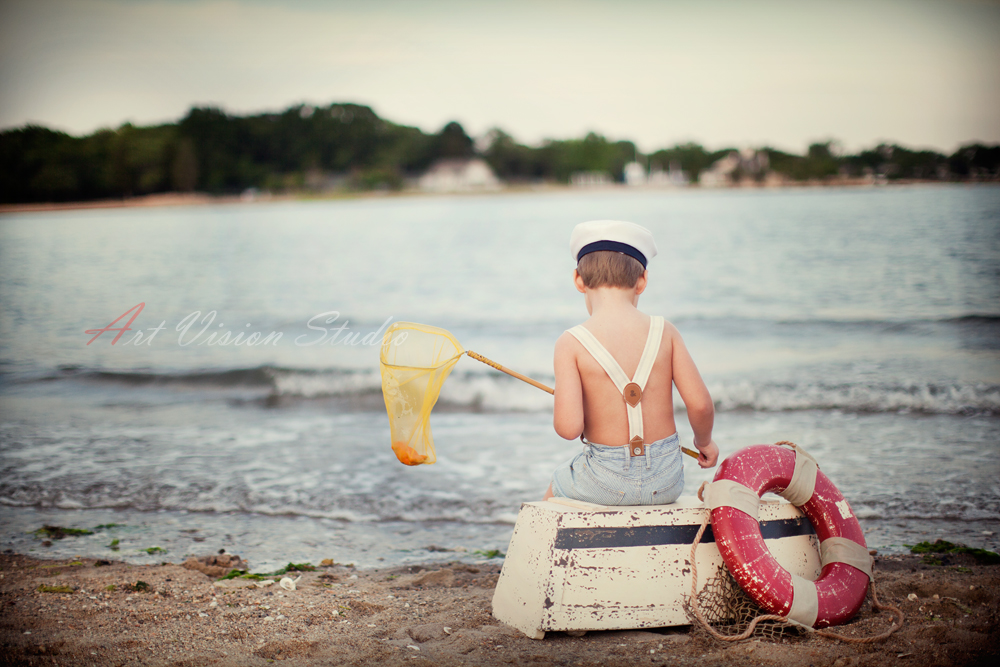 Little sailor themed beach session for a boy - The boy and the sea photography session