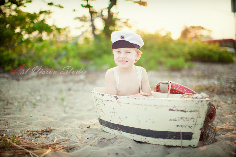  Toddler nautical themed photography session - A boy in a boat