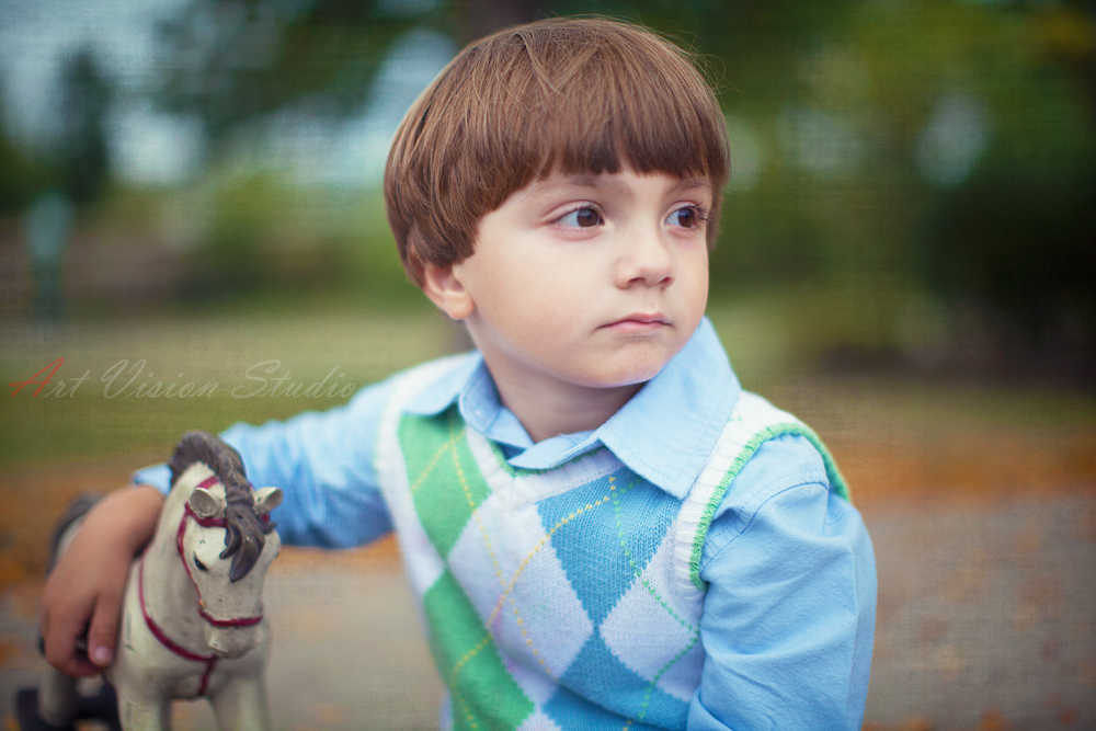Children photography by Art Vision Studio - Portrait of a boy with a rocking horse