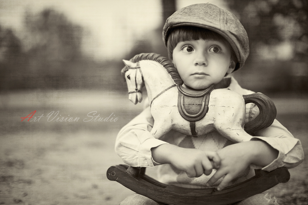 Vintage styled kids photography - Boy with a rocking horse